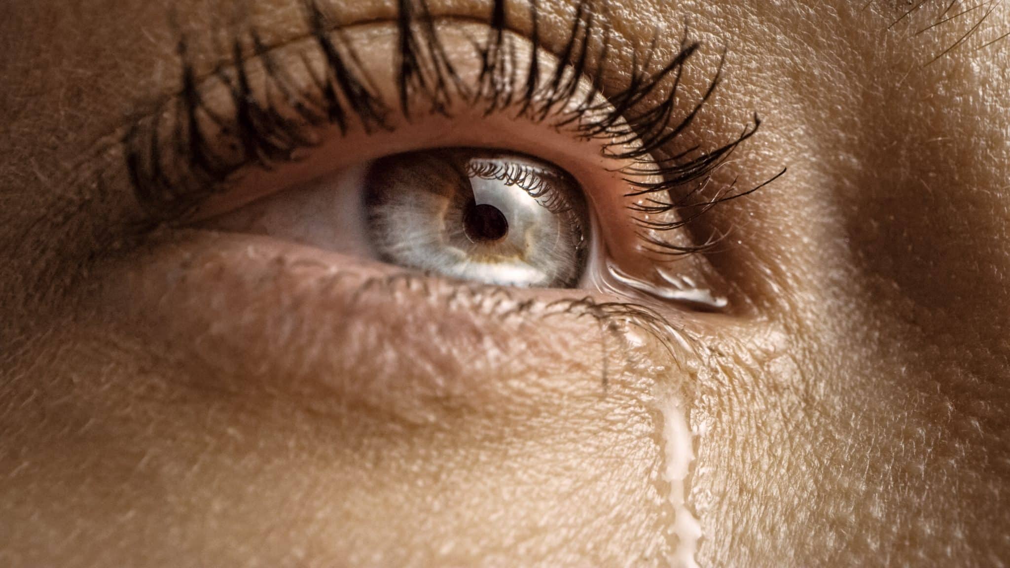 close,up,macro,shot,of,a,crying,eye.,young,beatiful