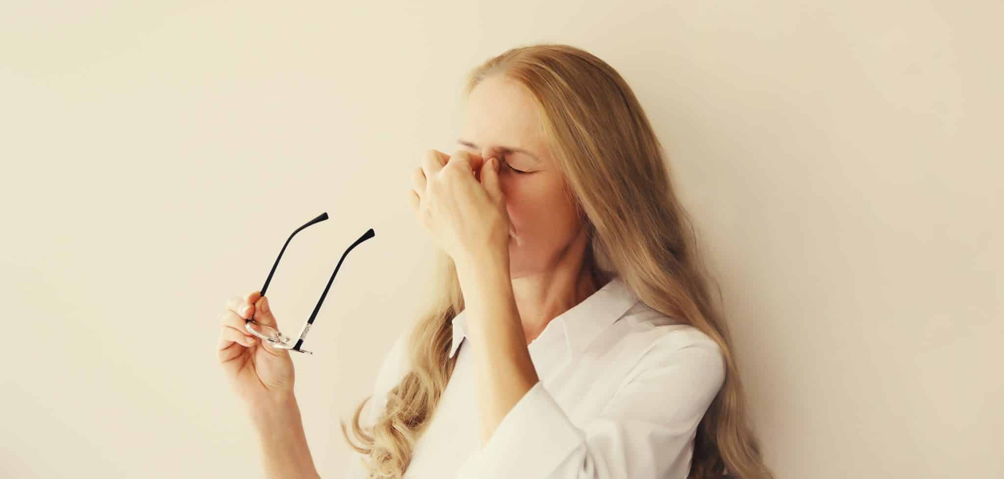 tired,overworked,woman,employee,rubbing,her,eyes,suffering,from,eye