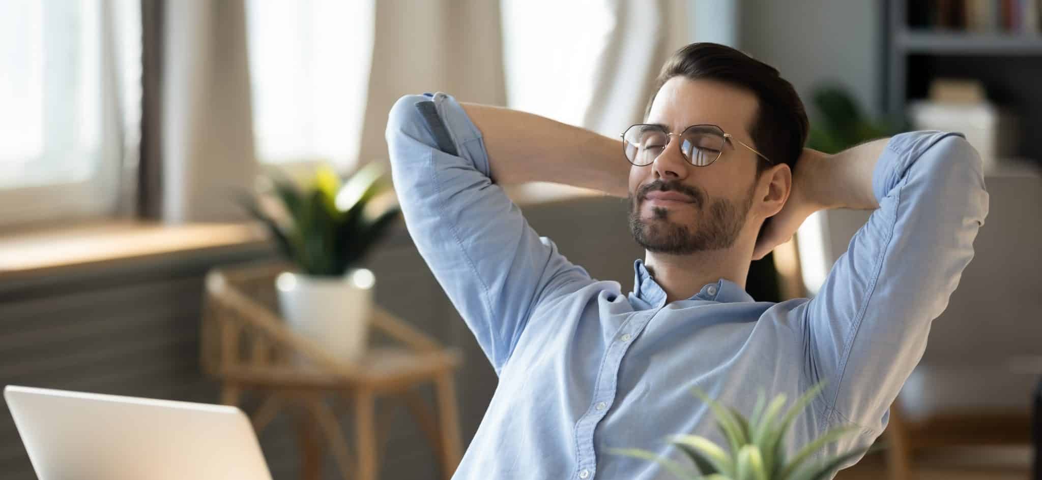 calm,millennial,man,in,glasses,sit,relax,at,home,office