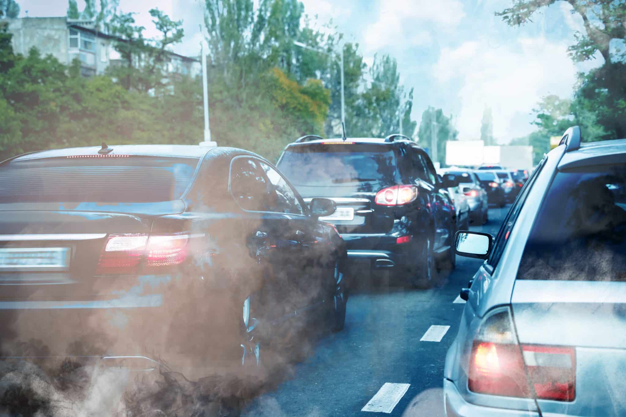 environmental,pollution.,air,contaminated,with,fumes,in,city.,cars,surrounded